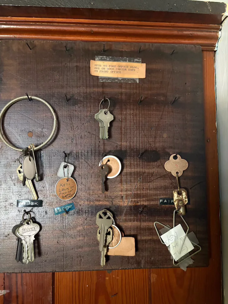Keys once in use at the rectory hang on hooks.